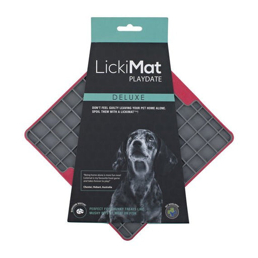 A red square hard case rubber mat with squares inside and a packing band around the LickiMat.